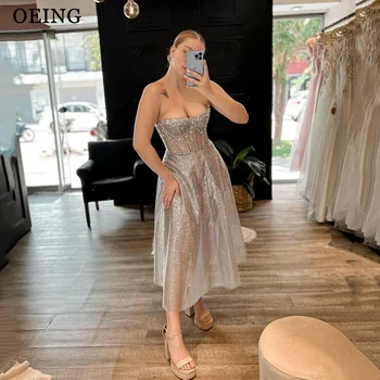 OEING Sparkly A Line Prom suknelės Elegantiškos krištolo arbatos ilgio be petnešėlių Iliuzija Vakariniai chalatai Paprasta vestuvių vakarėlio suknelė 2024